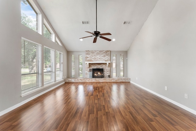 4807 Wind Chimes Dr, Houston, TX 77066 - unfurnished living room with healthy amount of natural light, wood finished floors, baseboards, and high vaulted ceiling