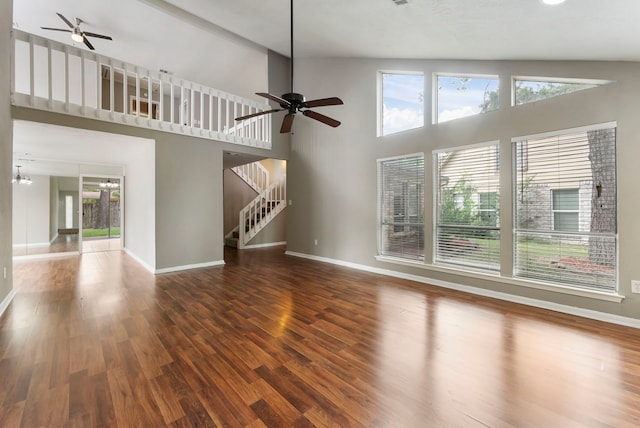 4807 Wind Chimes Dr, Houston, TX 77066 - unfurnished living room with ceiling fan, plenty of natural light, wood finished floors, and a towering ceiling