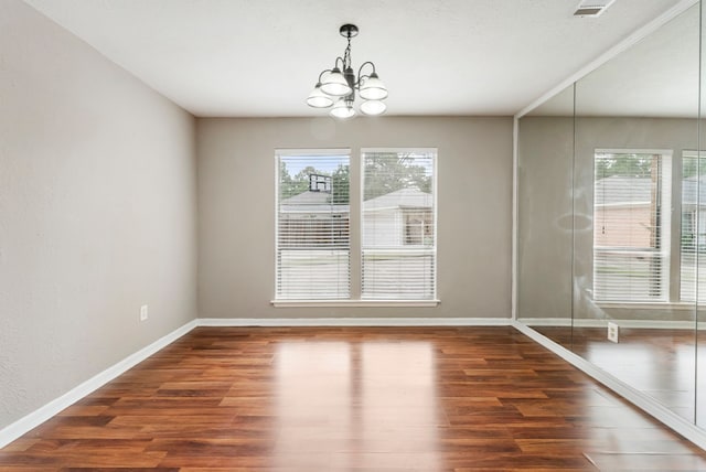 4807 Wind Chimes Dr, Houston, TX 77066 - unfurnished dining area featuring a chandelier, wood finished floors, and baseboards