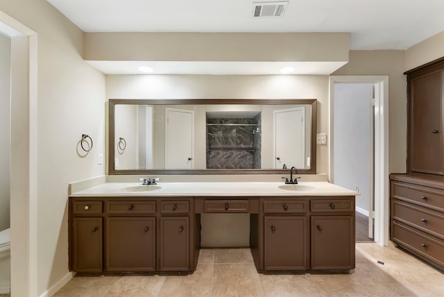4807 Wind Chimes Dr, Houston, TX 77066 - bathroom with double vanity, tiled shower, toilet, and baseboards