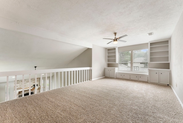 4807 Wind Chimes Dr, Houston, TX 77066 - carpeted spare room with a ceiling fan, a textured ceiling, baseboards, and vaulted ceiling
