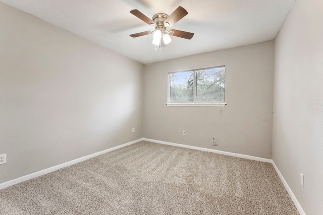 4807 Wind Chimes Dr, Houston, TX 77066 - spare room featuring carpet flooring, a ceiling fan, and baseboards