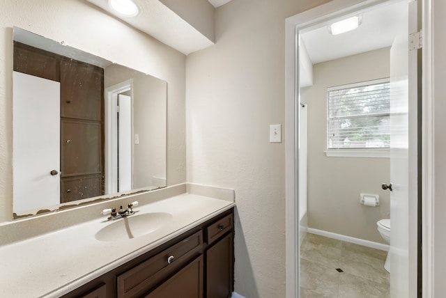 4807 Wind Chimes Dr, Houston, TX 77066 - full bathroom featuring vanity, toilet, baseboards, tile patterned floors, and shower / washtub combination