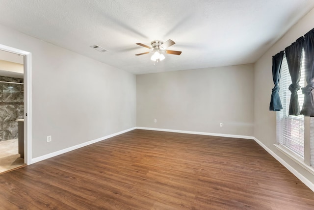 4807 Wind Chimes Dr, Houston, TX 77066 - empty room with ceiling fan, wood finished floors, and baseboards