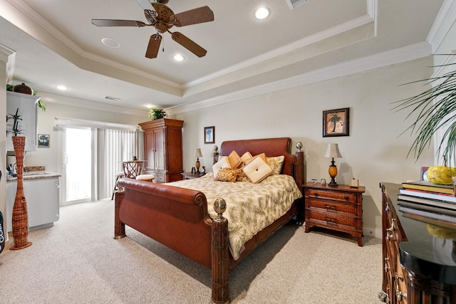 4115 Sand Hill Ct, Galveston, TX 77554 - bedroom featuring a tray ceiling, ornamental molding, light colored carpet, recessed lighting, and a ceiling fan