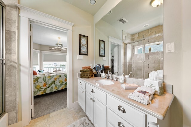 4115 Sand Hill Ct, Galveston, TX 77554 - ensuite bathroom featuring a stall shower, ceiling fan, and vanity