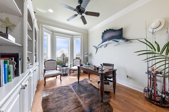 4115 Sand Hill Ct, Galveston, TX 77554 - office area featuring crown molding, baseboards, ceiling fan, and light wood-style floors