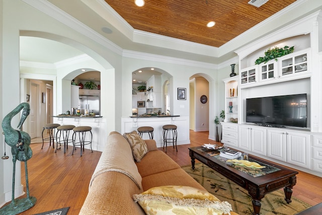 4115 Sand Hill Ct, Galveston, TX 77554 - living room featuring wood finished floors, wooden ceiling, a raised ceiling, crown molding, and baseboards