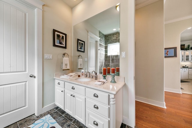 4115 Sand Hill Ct, Galveston, TX 77554 - full bath featuring vanity, baseboards, ornamental molding, and wood finished floors
