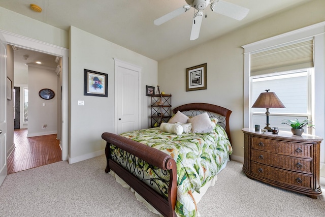 4115 Sand Hill Ct, Galveston, TX 77554 - carpeted bedroom with baseboards and a ceiling fan