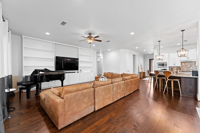 10110 Da Vinci Ct, Iowa Colony, TX 77583 - living room featuring a ceiling fan, dark wood finished floors, and recessed lighting