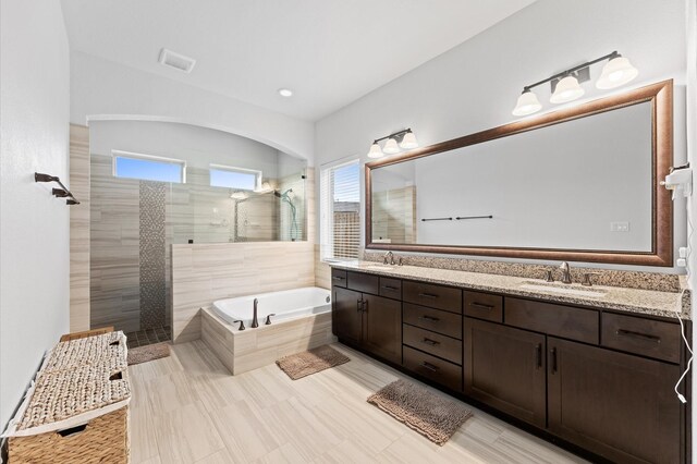 10110 Da Vinci Ct, Iowa Colony, TX 77583 - bathroom with a garden tub, double vanity, a walk in shower, and recessed lighting