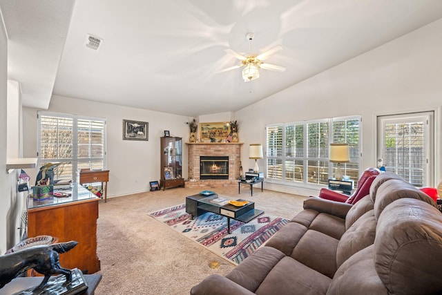 125 Terrace Ln E, Kerrville, TX 78028 - carpeted living room featuring ceiling fan, vaulted ceiling, a brick fireplace, and baseboards