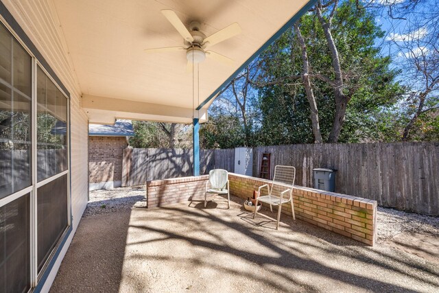 125 Terrace Ln E, Kerrville, TX 78028 - fenced backyard featuring a patio and a ceiling fan