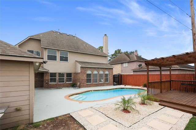14314 Strutton Dr, Sugar Land, TX 77498 - view of swimming pool with a fenced backyard, a deck, and a patio area