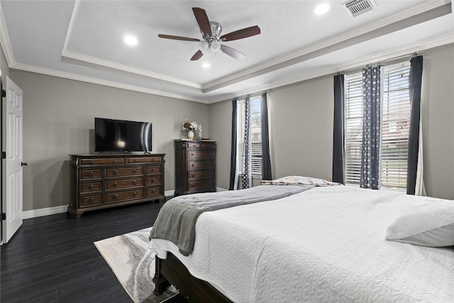 14314 Strutton Dr, Sugar Land, TX 77498 - bedroom with a raised ceiling, multiple windows, dark wood-style flooring, baseboards, and recessed lighting