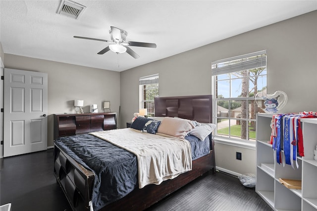 14314 Strutton Dr, Sugar Land, TX 77498 - bedroom featuring multiple windows, baseboards, ceiling fan, and wood finished floors