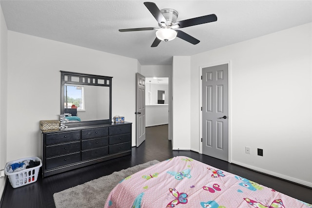 14314 Strutton Dr, Sugar Land, TX 77498 - bedroom with dark wood finished floors, baseboards, and a ceiling fan