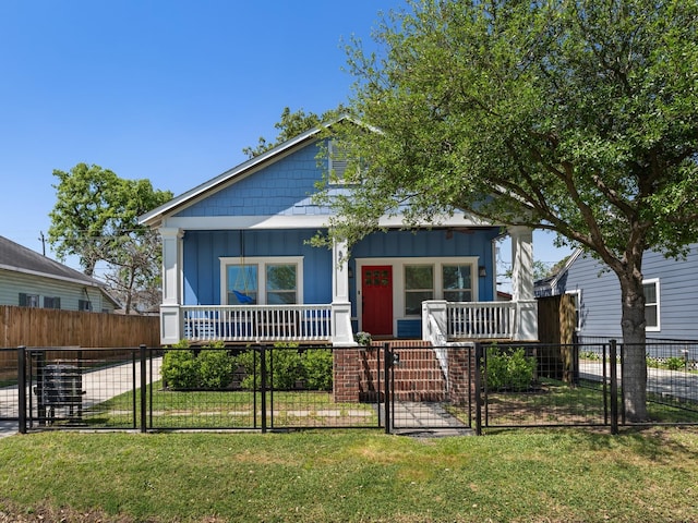 807 Vincent St, Houston, TX 77009 - view of front of property with covered porch, board and batten siding, and a gate