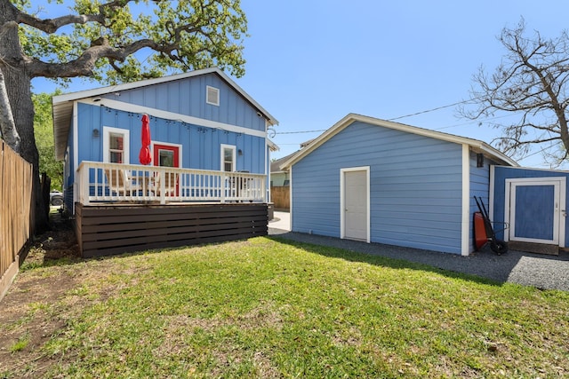 807 Vincent St, Houston, TX 77009 - rear view of property with board and batten siding, a deck, and an outdoor structure