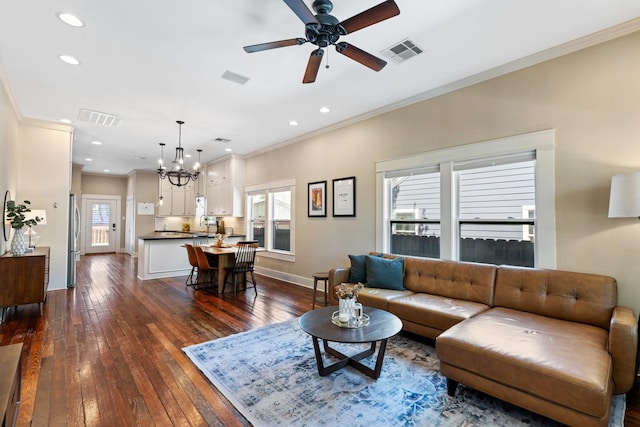 807 Vincent St, Houston, TX 77009 - living area with crown molding, dark wood-style floors, ceiling fan, a chandelier, and recessed lighting