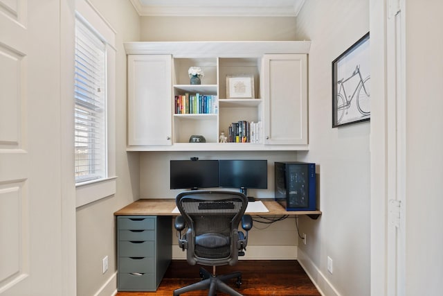 807 Vincent St, Houston, TX 77009 - home office with built in study area, ornamental molding, wood finished floors, and baseboards