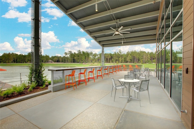 17333 July Moon Ln, Conroe, TX 77302 - view of patio featuring ceiling fan, view of wooded area, and a water view
