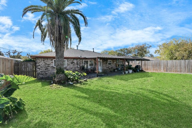 1110 E Brown Ln, Deer Park, TX 77536 - back of property featuring a patio area and a shingled roof