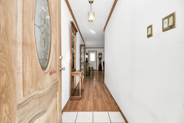 1110 E Brown Ln, Deer Park, TX 77536 - hallway with crown molding and light wood finished floors