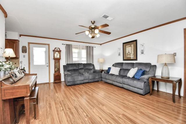 1110 E Brown Ln, Deer Park, TX 77536 - living area featuring ceiling fan, light wood finished floors, and crown molding