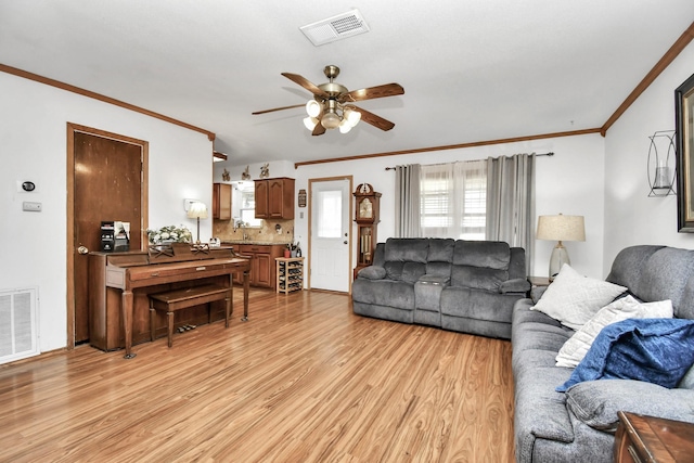 1110 E Brown Ln, Deer Park, TX 77536 - living area featuring ceiling fan, light wood finished floors, and ornamental molding
