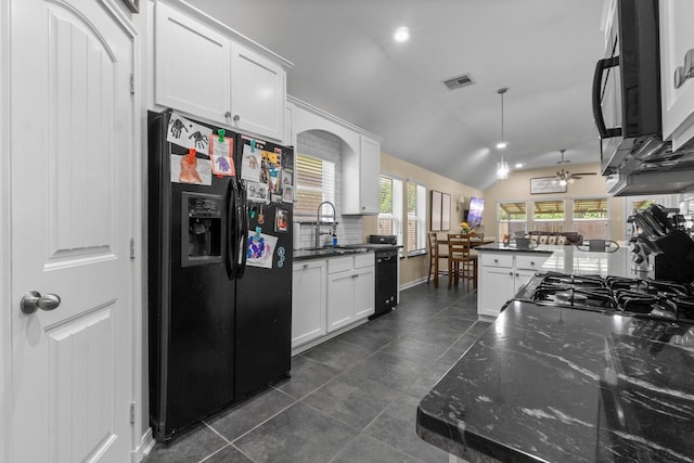 28987 Birch Green Way, Spring, TX 77386 - kitchen featuring black appliances, ceiling fan, vaulted ceiling, white cabinets, and dark tile patterned floors