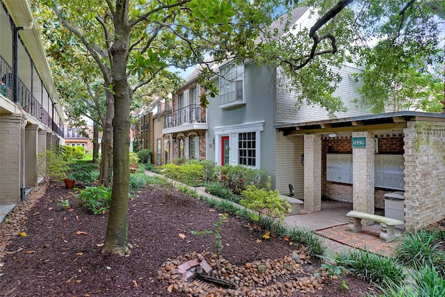 11550 Chimney Rock Rd Unit 324, Houston, TX 77035 - rear view of property with brick siding and a garage