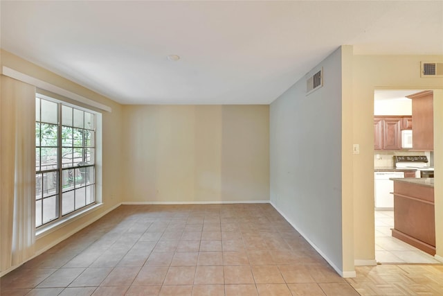 11550 Chimney Rock Rd Unit 324, Houston, TX 77035 - spare room with light tile patterned flooring and baseboards