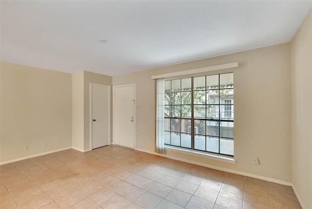 11550 Chimney Rock Rd Unit 324, Houston, TX 77035 - empty room with light tile patterned floors and baseboards