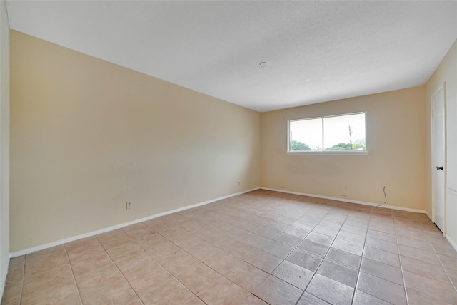 11550 Chimney Rock Rd Unit 324, Houston, TX 77035 - empty room with light tile patterned flooring and baseboards