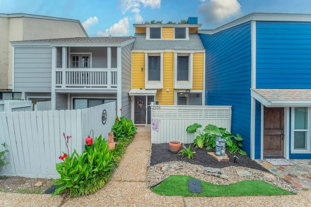 2304 Keel Ct, Willis, TX 77318 - view of property featuring a balcony and a shingled roof