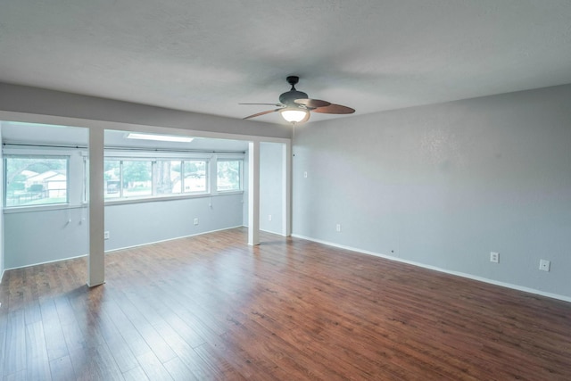 2304 Keel Ct, Willis, TX 77318 - unfurnished bedroom featuring wood finished floors, baseboards, and a ceiling fan