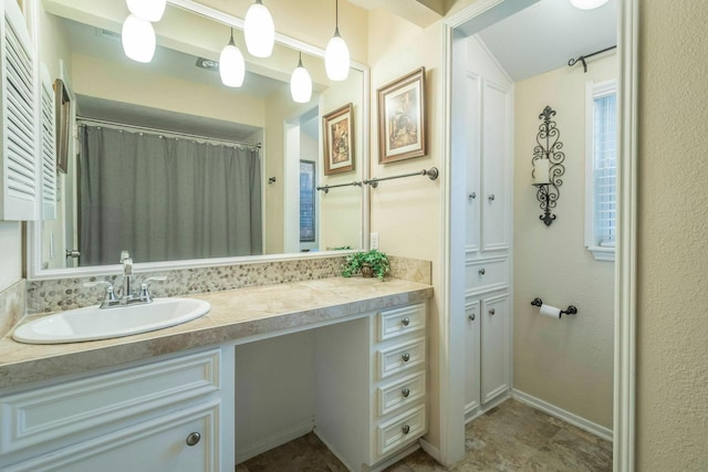 2304 Keel Ct, Willis, TX 77318 - full bathroom with vanity and baseboards