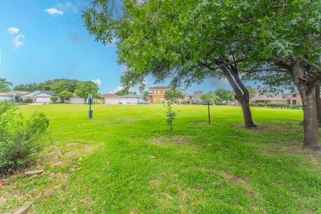 2304 Keel Ct, Willis, TX 77318 - view of green lawn with a residential view