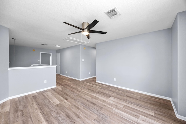 612 Hartman Dr, Baytown, TX 77521 - unfurnished room with attic access, a ceiling fan, wood finished floors, and a textured ceiling