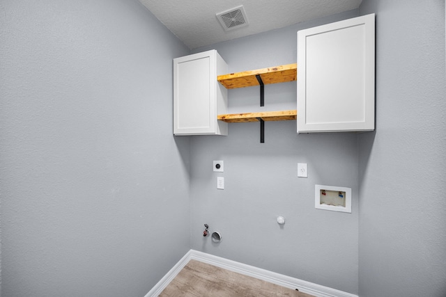 612 Hartman Dr, Baytown, TX 77521 - laundry area featuring hookup for a gas dryer, washer hookup, baseboards, hookup for an electric dryer, and wood finished floors