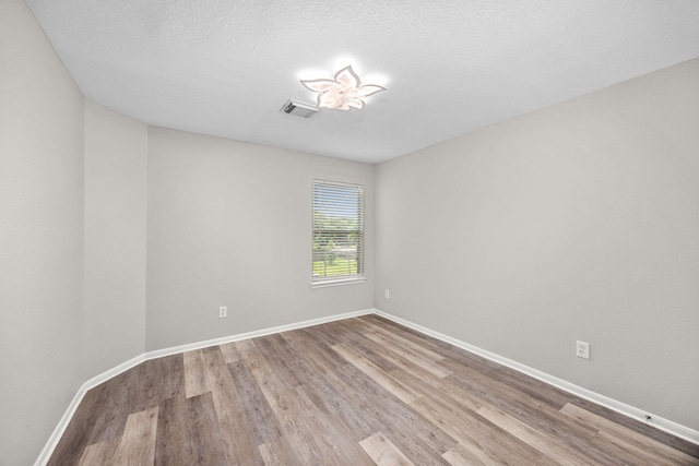 612 Hartman Dr, Baytown, TX 77521 - empty room with wood finished floors and baseboards