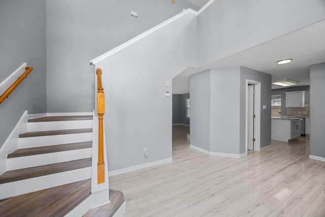 612 Hartman Dr, Baytown, TX 77521 - stairway with wood finished floors and baseboards