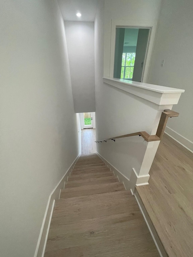 6412 Highland Pine Ln, Houston, TX 77091 - stairway featuring wood finished floors and baseboards