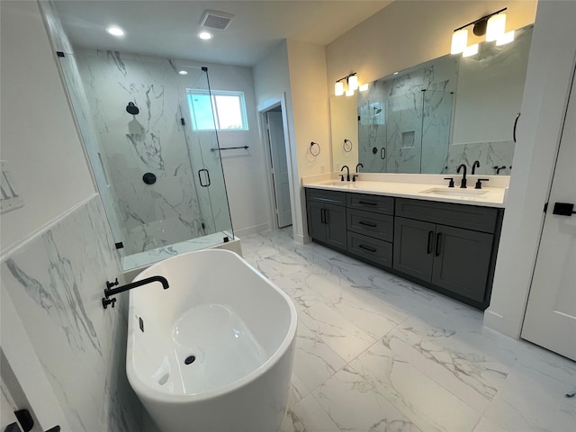 6412 Highland Pine Ln, Houston, TX 77091 - full bathroom featuring a marble finish shower, double vanity, a freestanding bath, marble finish flooring, and recessed lighting