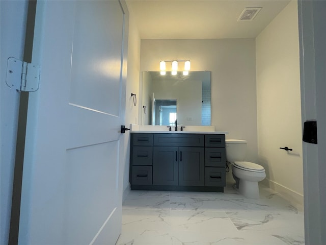 6412 Highland Pine Ln, Houston, TX 77091 - bathroom with baseboards, toilet, vanity, and marble finish flooring