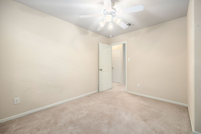 6352 Austinville Dr, Katy, TX 77449 - unfurnished room featuring a ceiling fan, light carpet, and baseboards