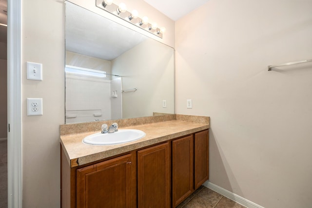 6352 Austinville Dr, Katy, TX 77449 - bathroom with vanity, tile patterned flooring, and baseboards