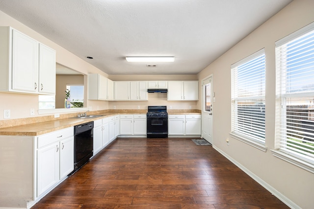 6352 Austinville Dr, Katy, TX 77449 - kitchen with black appliances, a sink, light countertops, and plenty of natural light